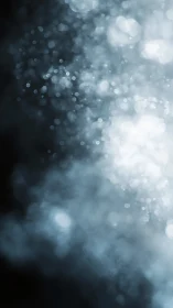 Defocused light particles form cool blue abstract bokeh field