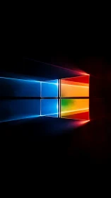 Luminous four‑panel window logo on deep black backdrop.