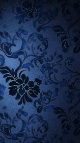 Embossed navy floral damask wallpaper with directional side lighting