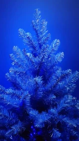 Electric blue Christmas tree glows against vivid backdrop