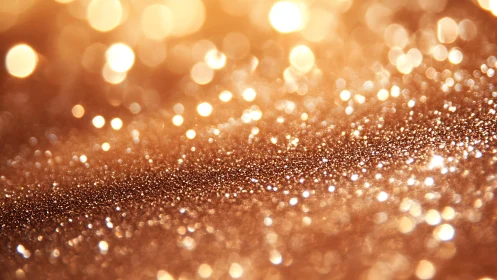 Golden glitter surface with bokeh lights in festive abstract style.