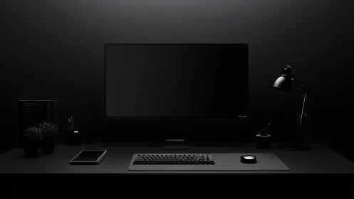 Minimalist black workstation glows under focused desk lamp.