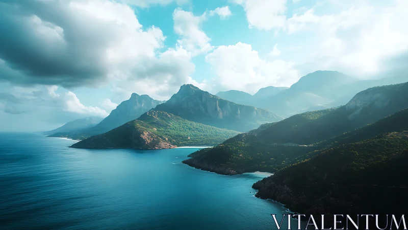 Coastal mountain headlands under layered clouds and haze.
