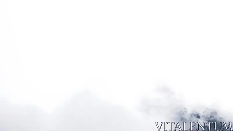 Minimalist mountain landscape shrouded in mist and soft clouds.