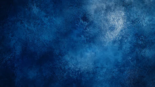 Deep cobalt textured backdrop with diffused cool light.