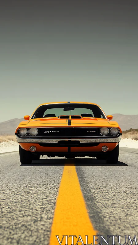 Front view of orange muscle car on empty desert highway.