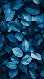 Dense layer of blue-toned leaves fills the vertical frame