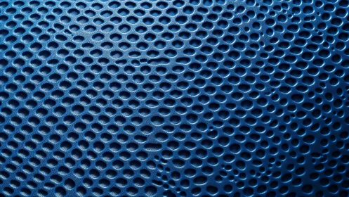 Macro blue perforated surface forms rhythmic cellular texture