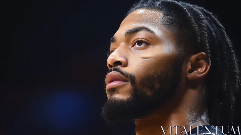 Focused basketball player gazes upward with calm determination