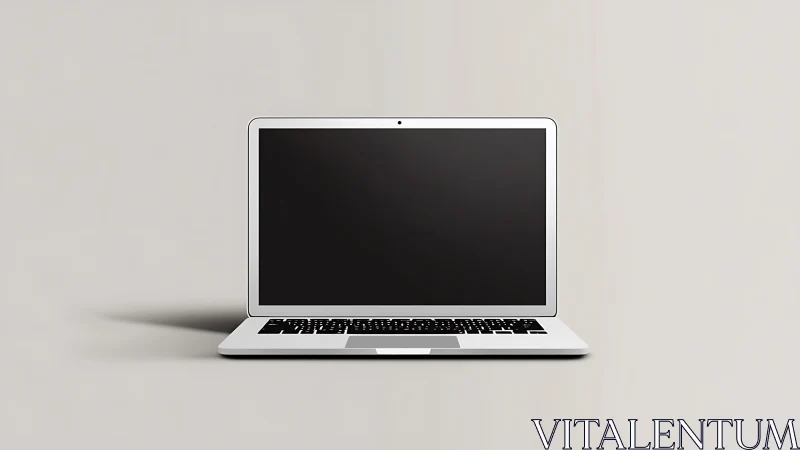 Minimalist silver laptop centered on soft gray background.