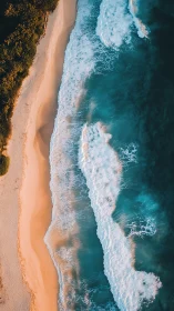 Sunlit tropical shoreline with teal surf from above.