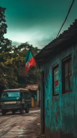 Weathered village street with hanging flag under moody sky