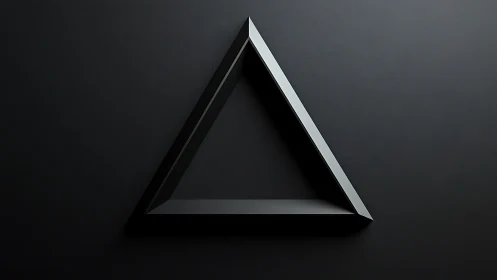 Black metallic triangle on dark minimalist background.