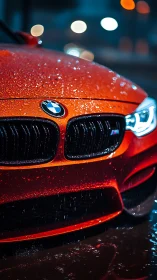 Rain-soaked red sports sedan front grille in night bokeh
