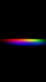 Horizontal RGB spectrum band glows against deep black field