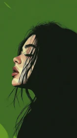 Profile portrait in deep shadows with emerald backdrop.