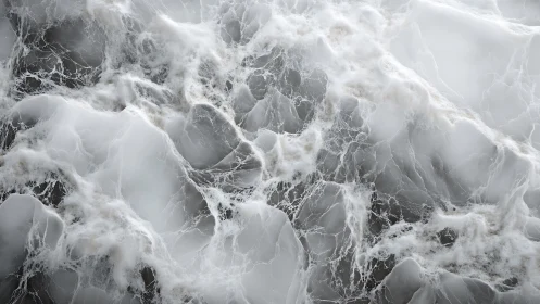 Marble-like abstract texture with white veining pattern.