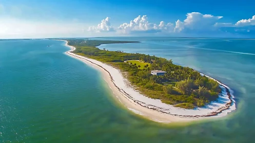 Emerald Crescent: Where Turquoise Waters Cradle a Verdant Paradise.