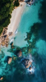 Turquoise Coastal Paradise with Rocky Outcrops and Pristine Beach
