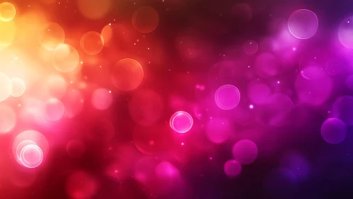 Vibrant bokeh light abstract in warm red, pink, and purple tones.