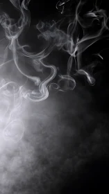 White smoke curls rise through dark negative space background
