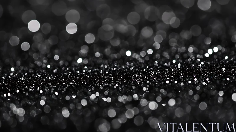 Glittering black bokeh lights shimmer in soft abstract focus