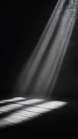 Single beam of light cuts through darkness onto worn floor