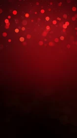 Red bokeh light pattern on dark gradient background.