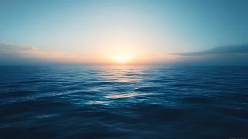 Gentle ocean sunrise casting soft light across calm waves.