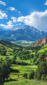 Mountain valley landscape shows green fields and distant peaks