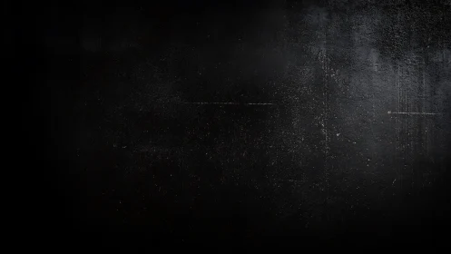 Dark textured wall surface with subtle scratches and marks.