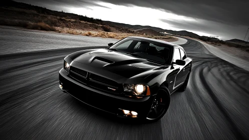 Black muscle car powers through sweeping desert racetrack.