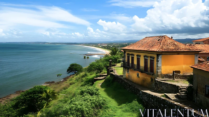 Coastal hillside village with tiled roofs and calm shoreline.
