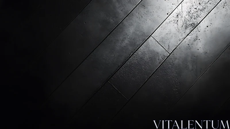 Oblique top view of wet textured black floor panels in shadow