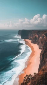 Aerial coastal escarpment with turquoise surf dynamics.