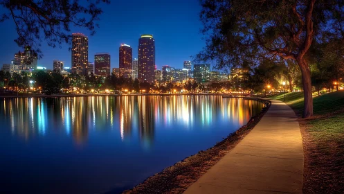 City lights shimmer gently across a calm evening lakeside