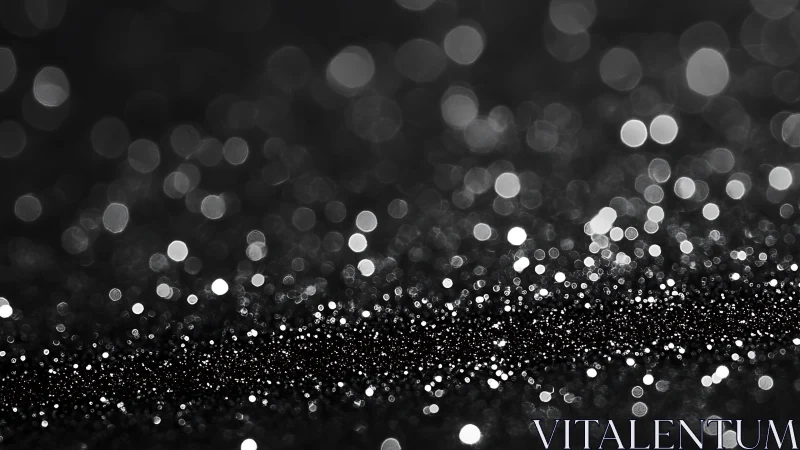 Black and white glitter bokeh with dense sparkling foreground.