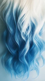 White to blue ombre wavy hair close-up on pale background.