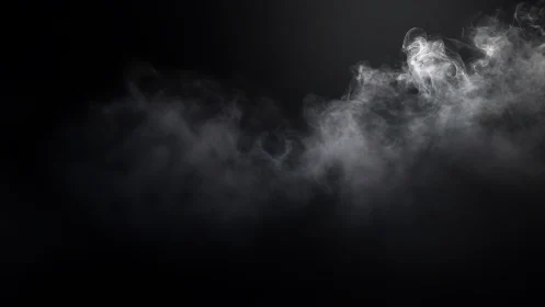 White smoke cloud drifting across dark black background.