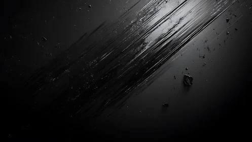 Dark abstract streaks across gloss black surface.