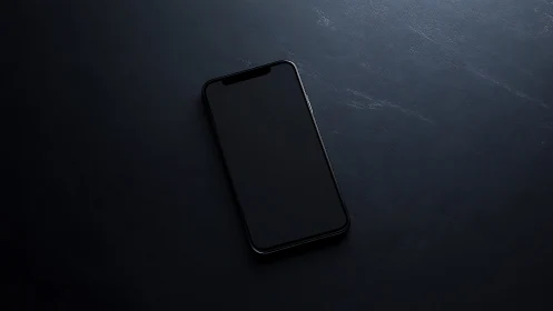 Sleek Smartphone Resting on Dark Textured Surface