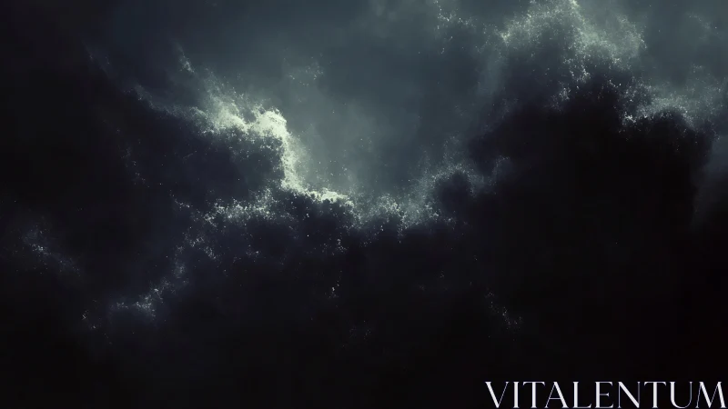 Dark storm cloud mass with pale light breaking through.