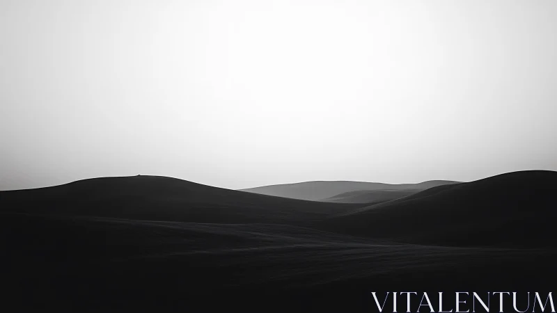 Gentle desert dunes resting under a quiet silver sky.