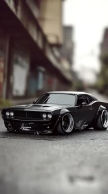 Custom black muscle car stands low on wet urban street.