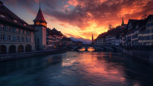 European riverside town under intense sunset sky at dusk.