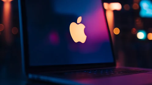 Glowing fruit silhouette hums quietly in neon laptop dusk