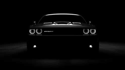 Front view of black performance car in dark studio.