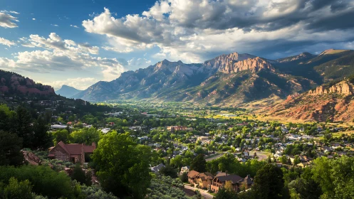 Orographic front-lit Rockies over suburban valley settlement.
