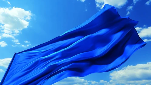Bright blue flag dances freely in a wide open summer sky