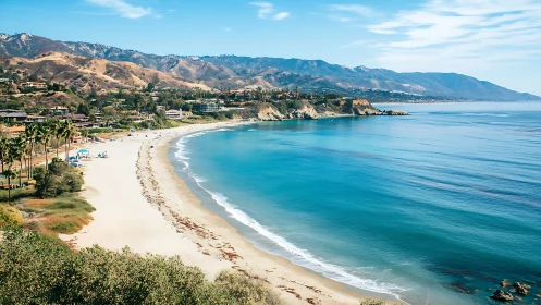Coastal bay morphology with terraced housing and calm littoral waters.